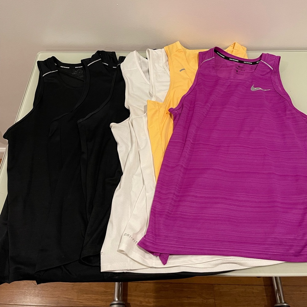 Seven (7) mens nike dri-fit miler tank tops (size L)